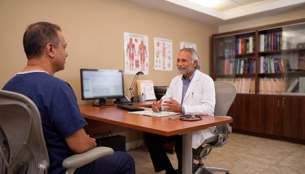 Patient consulting with physician in office